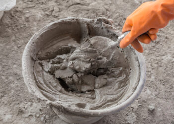 This man fills gloves with latex and uses them in his garden to hold flowers!
